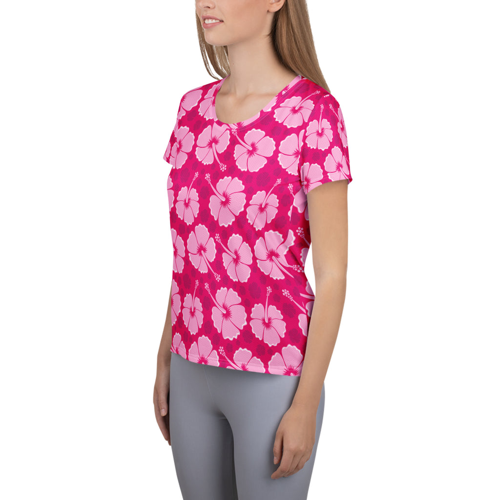 Women’s pink hibiscus performance athletic t-shirt with repeating lighter pink flowers, lightweight moisture wicking fabric and UPF 50+