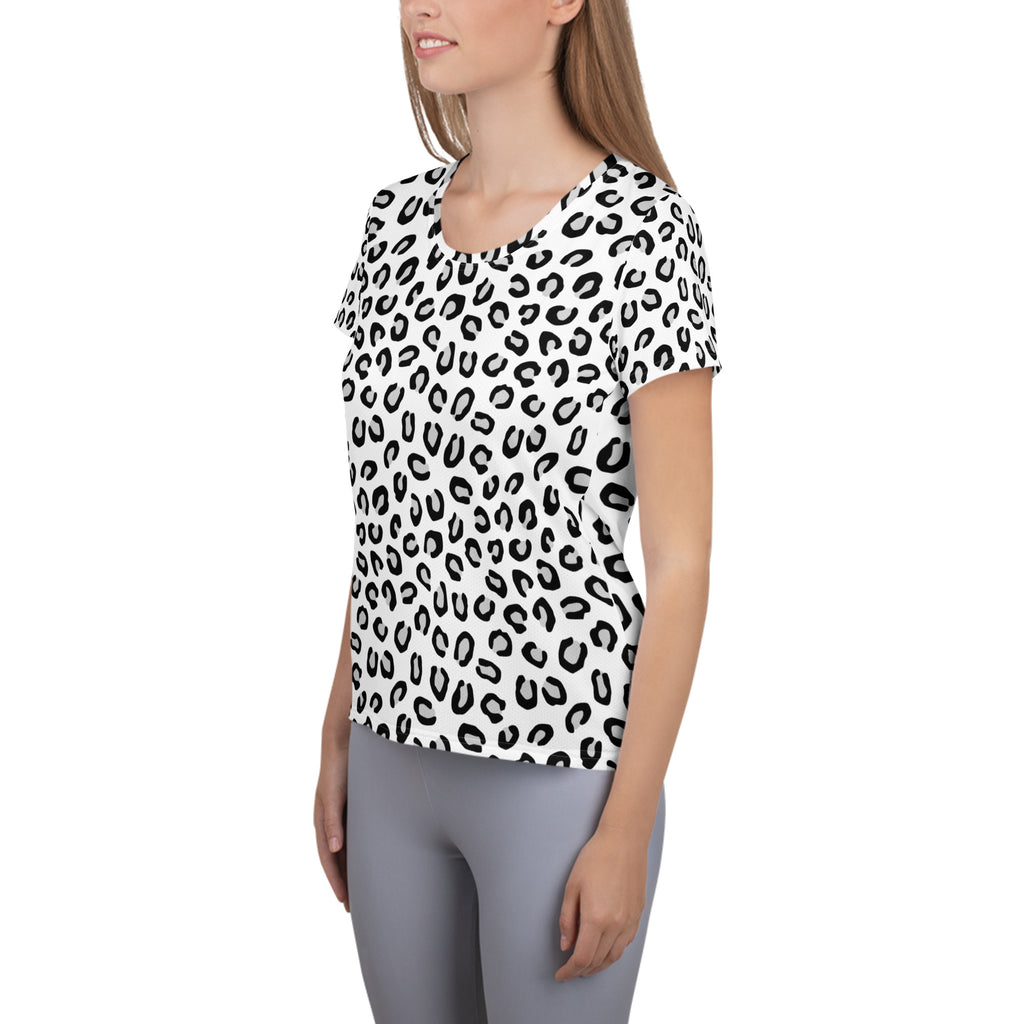 A white short-sleeved women’s athletic t-shirt with bold black leopard print lightweight moisture wicking fabric