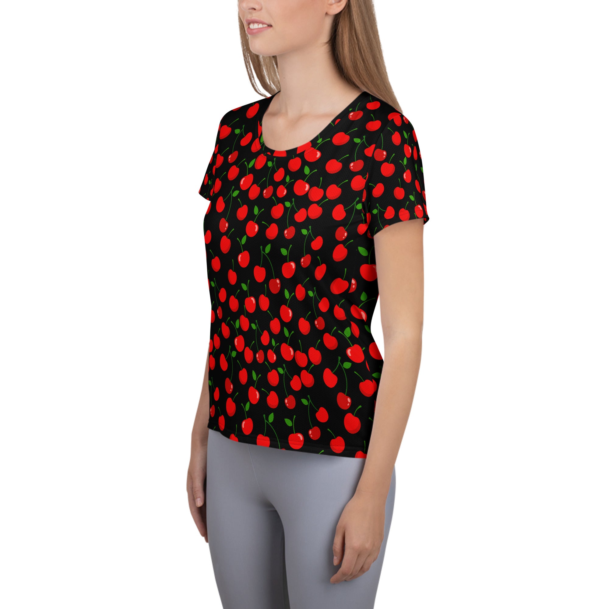 Women’s black short-sleeved performance athletic t-shirt with vibrant red cherry pattern, lightweight and moisture wicking