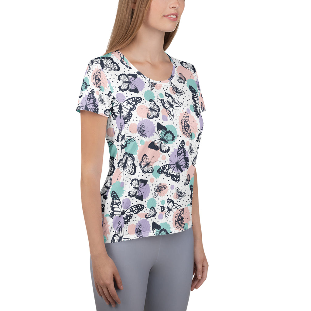 Women’s butterfly print short-sleeved performance t-shirt in black lavender and mint green on white with UPF 50+