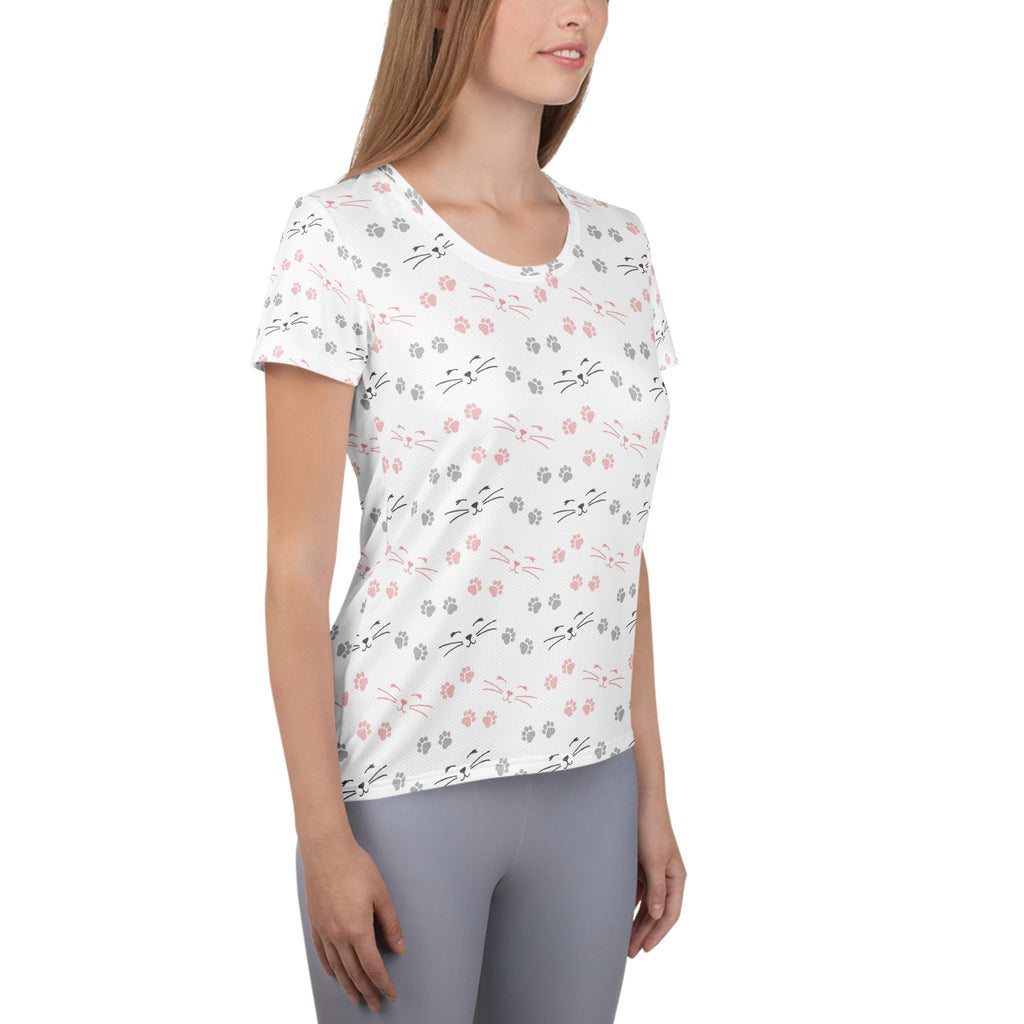 White short-sleeved women’s cat paw print performance t-shirt with pink and gray cat faces lightweight and moisture wicking