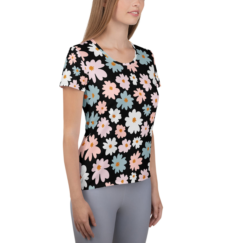 Black short-sleeved performance athletic t-shirt with vibrant pink white and blue daisies lightweight moisture wicking