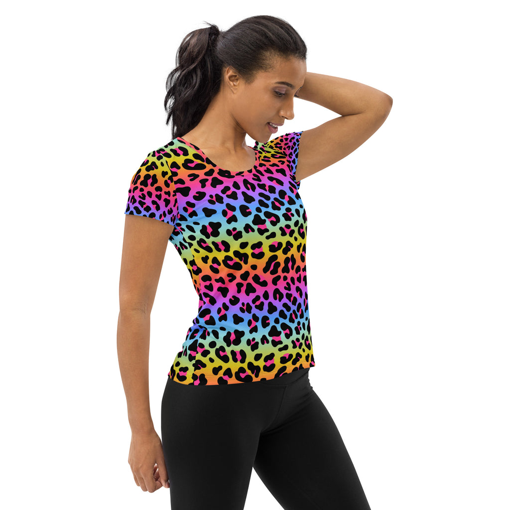 A vibrant rainbow-colored leopard print women’s short-sleeved performance t-shirt with moisture wicking fabric and UPF 50+