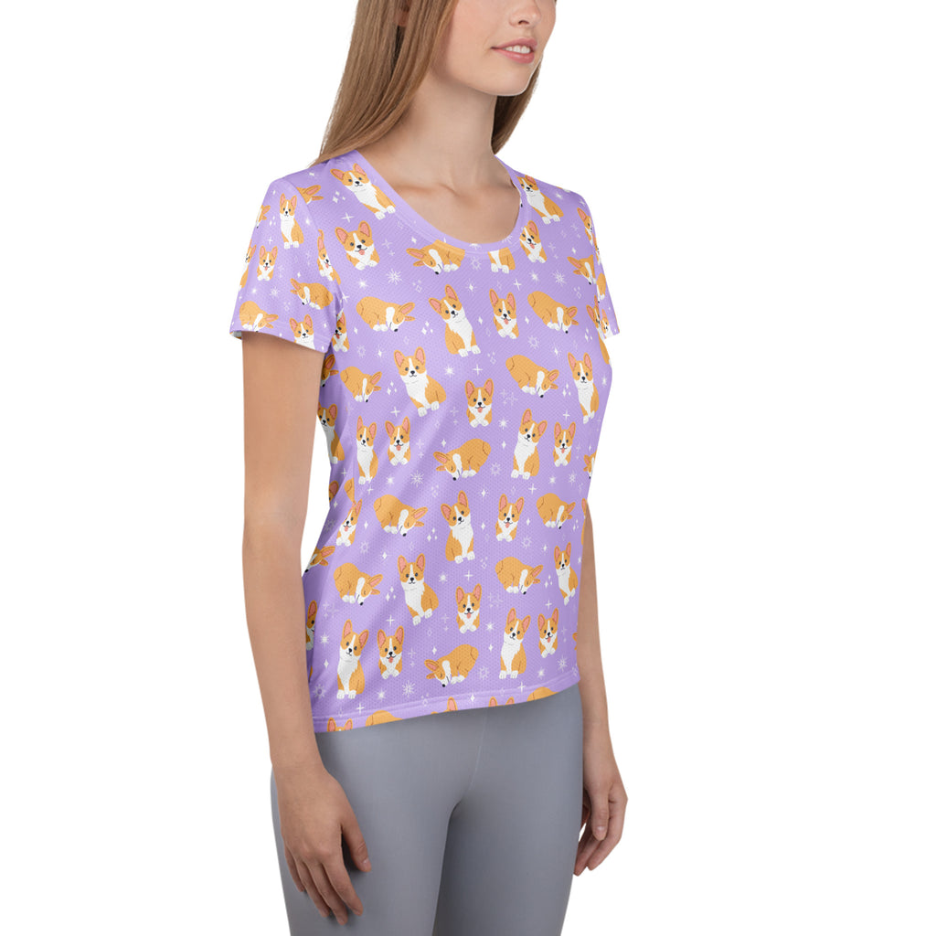 Women’s purple corgi dog performance athletic t-shirt with lightweight moisture wicking fabric and cartoon corgis pattern