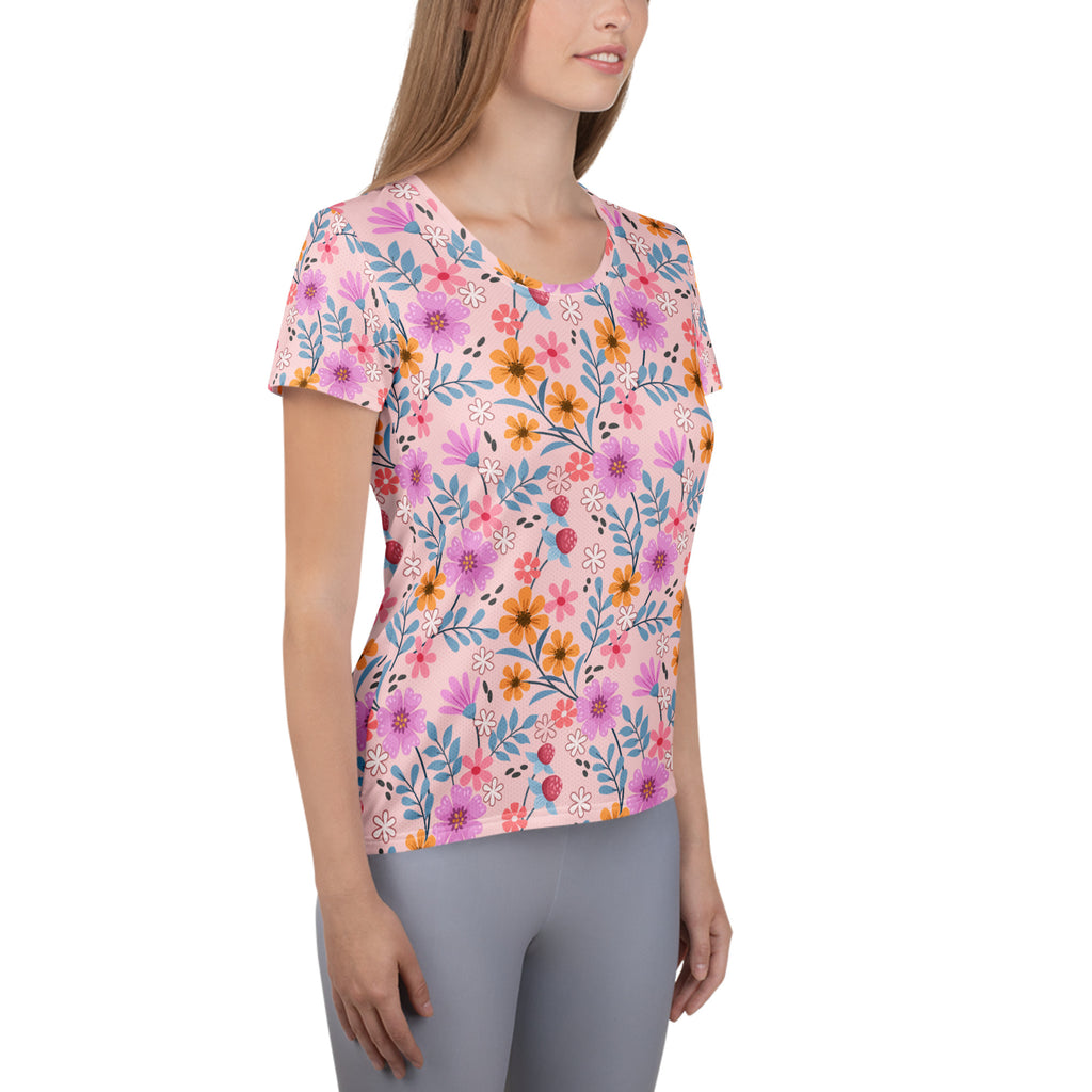 Women’s pink short-sleeved floral performance athletic t-shirt with moisture wicking fabric and UPF 50 plus protection