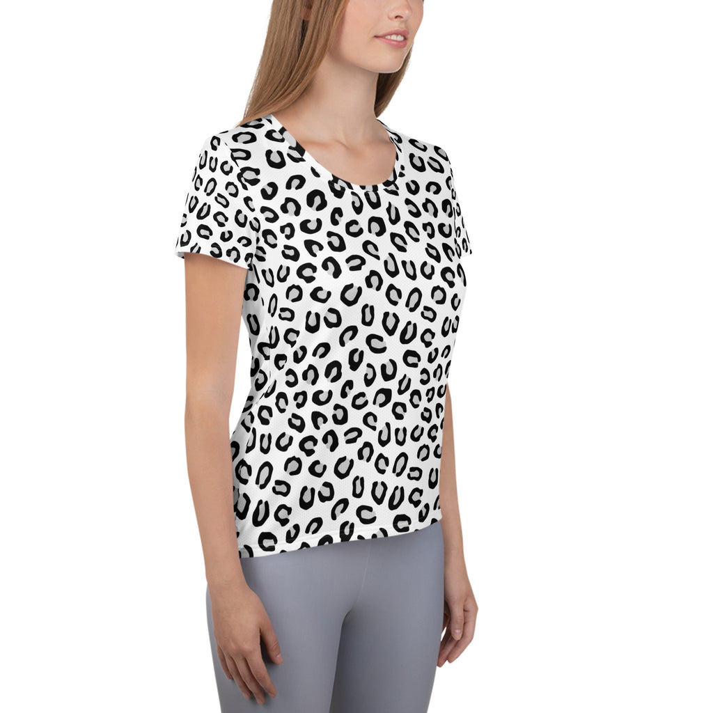 A white short-sleeved women’s athletic t-shirt with bold black leopard print and moisture wicking lightweight fabric