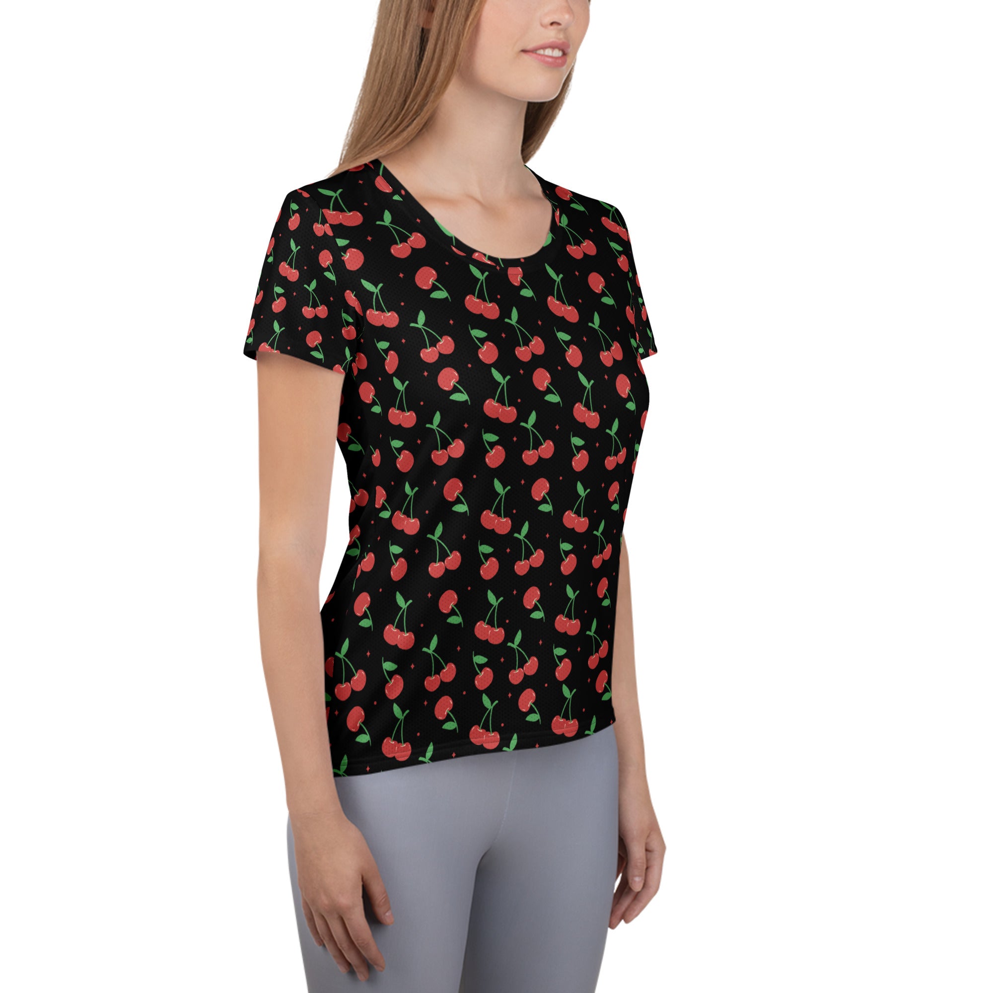 Black short-sleeved women’s cherry print performance athletic t-shirt with moisture wicking fabric and upf 50+ protection