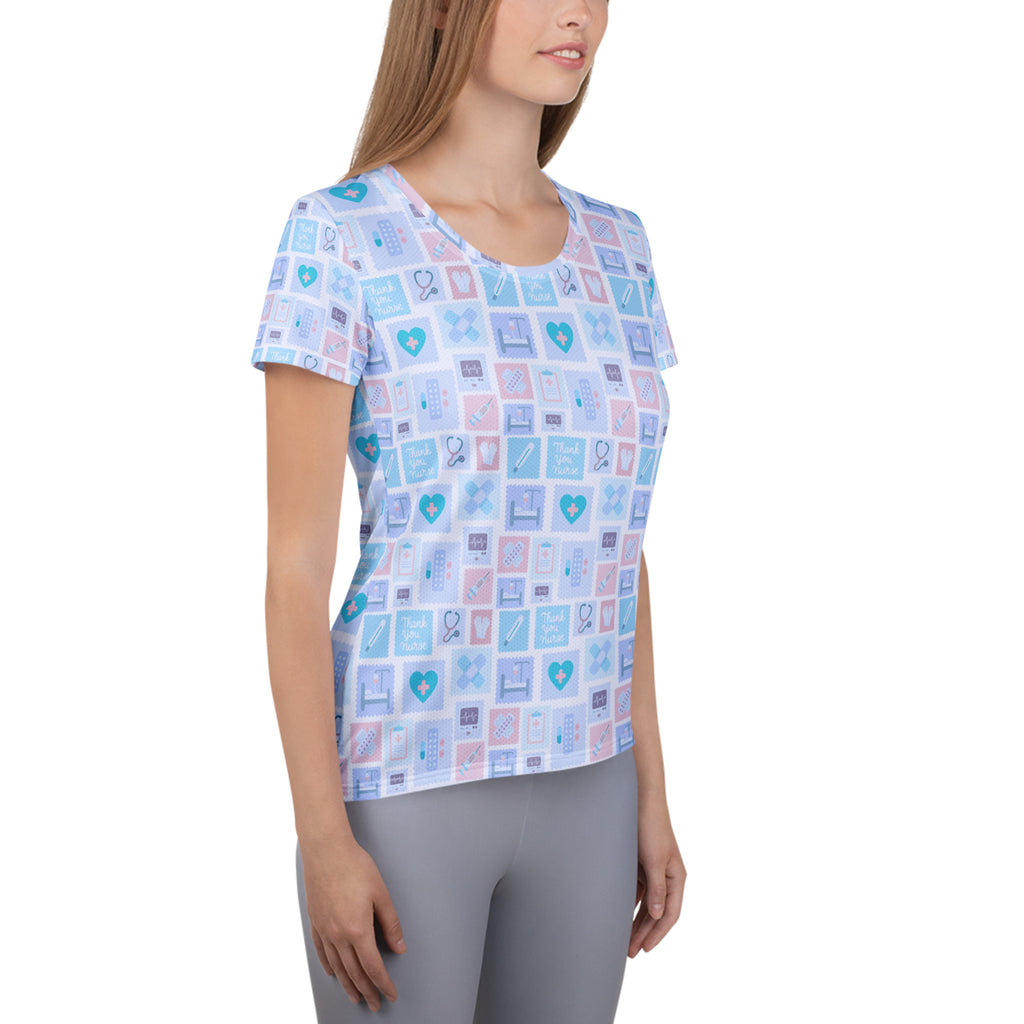Women’s blue nurse icon performance athletic t-shirt with light blue and pink medical graphics, lightweight and moisture wicking
