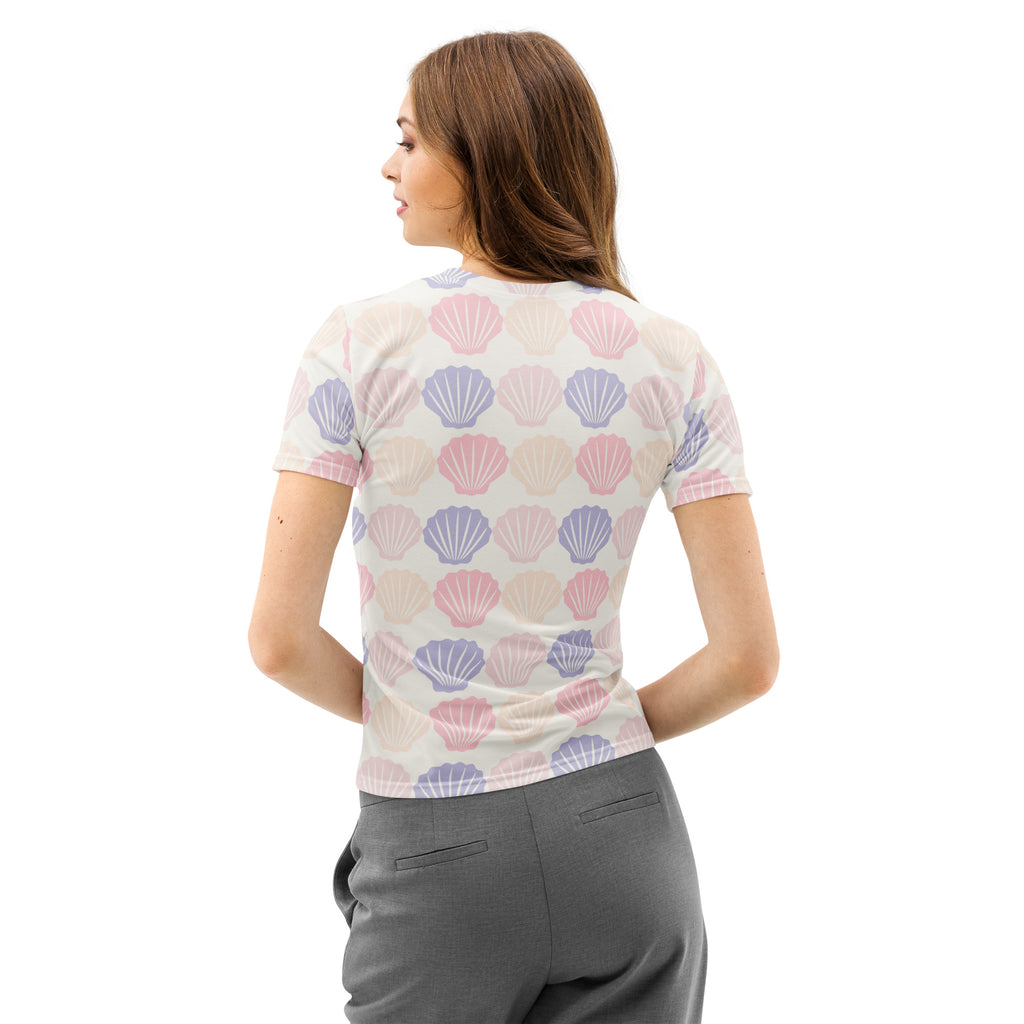 Women’s pastel seashell cotton t-shirt with short sleeves featuring pink and lavender seashells on cream background