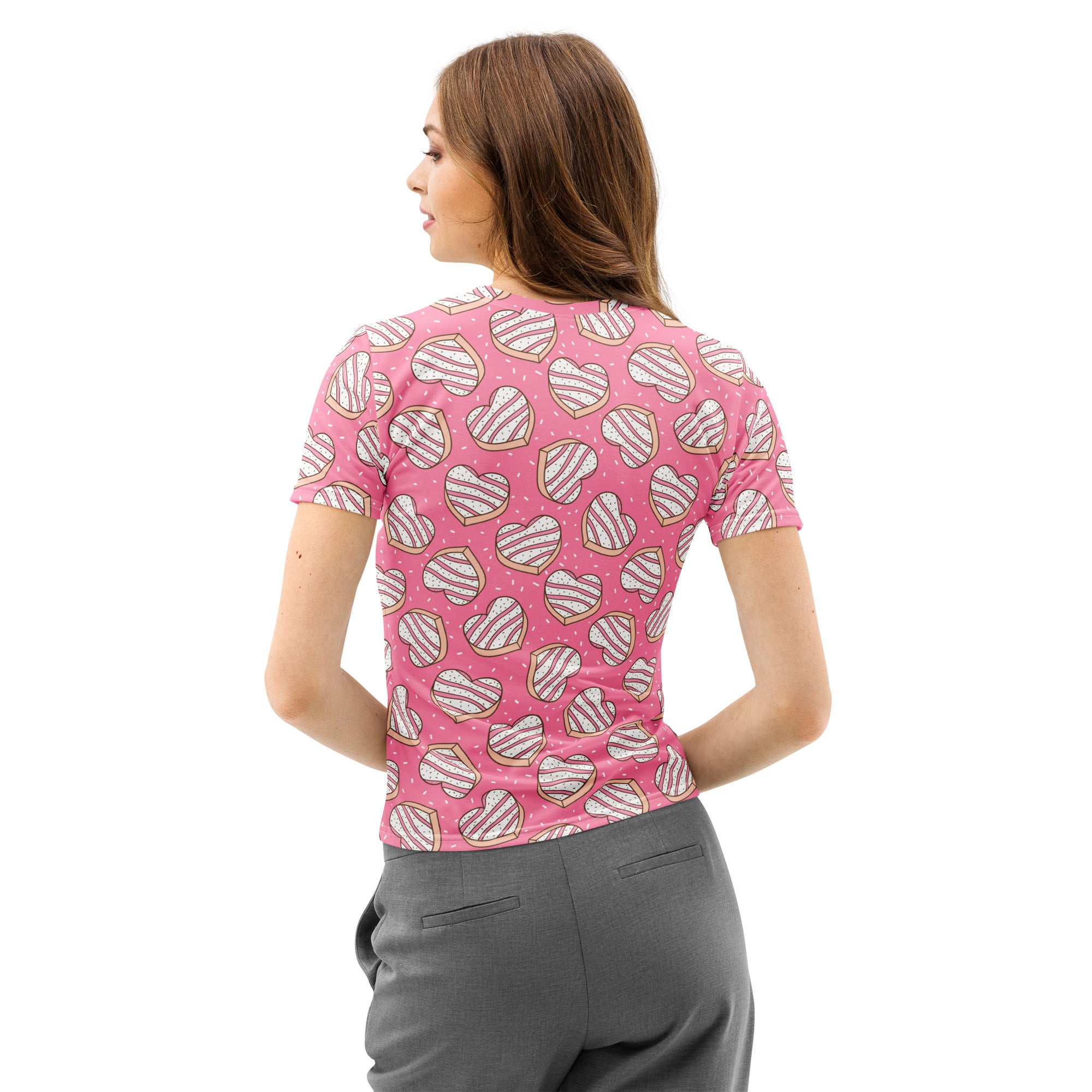 Women’s pink cotton t-shirt with soft stretch featuring a playful heart-shaped donut pattern with white icing stripes