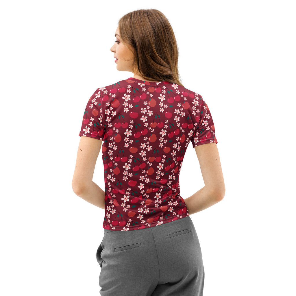 A maroon women’s cotton t-shirt with short sleeves featuring a vibrant red cherry and pink cherry blossom pattern