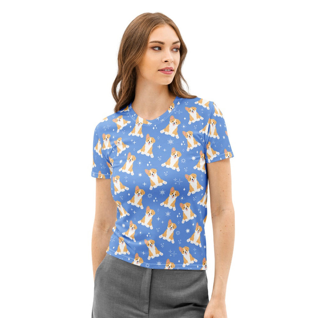 Women’s blue cotton t-shirt with soft stretch featuring a repeating cartoon corgi and snowflake pattern