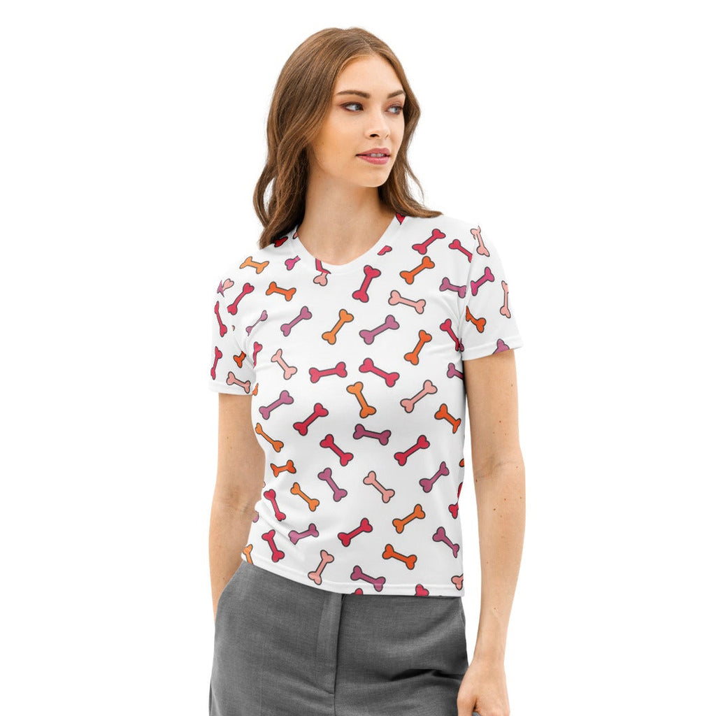 White women’s cotton t-shirt with short sleeves and a playful multicolored dog bone print in pink red and orange