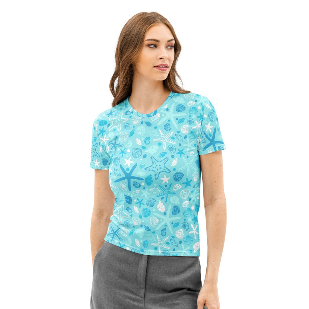 Women’s light blue cotton t-shirt with playful white and dark blue starfish and shells pattern soft stretch pilling resistant