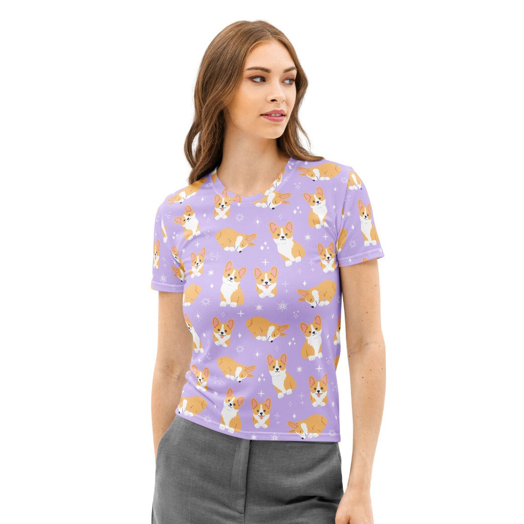 Lavender cotton women’s short-sleeved t-shirt with playful tan and white corgi print and subtle star accents
