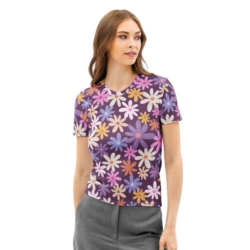 Women’s purple cotton t-shirt with short sleeves featuring a vibrant floral pattern with daisies in pink white yellow and blue