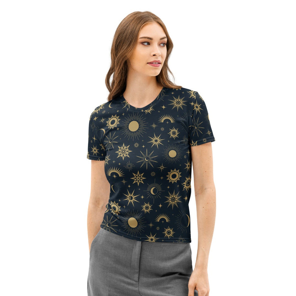 Woman wearing a dark t-shirt with celestial pattern and gray pants on a white background