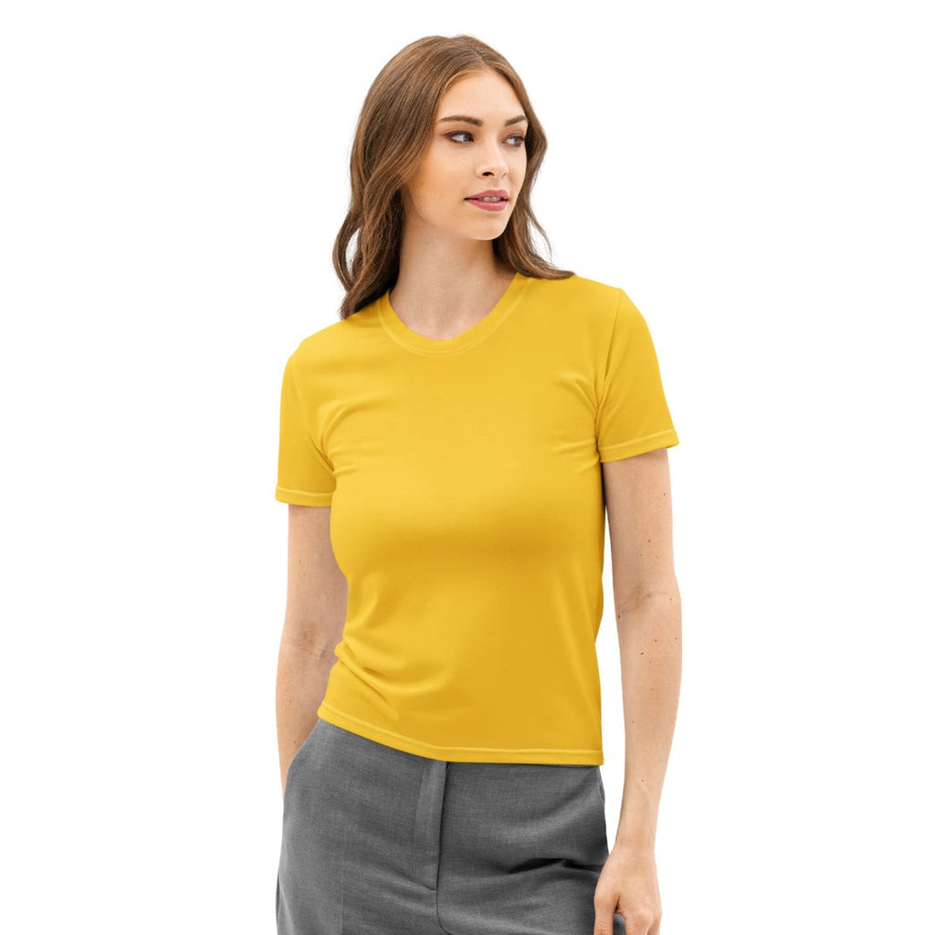 Woman wearing a yellow t-shirt and gray pants on a white background