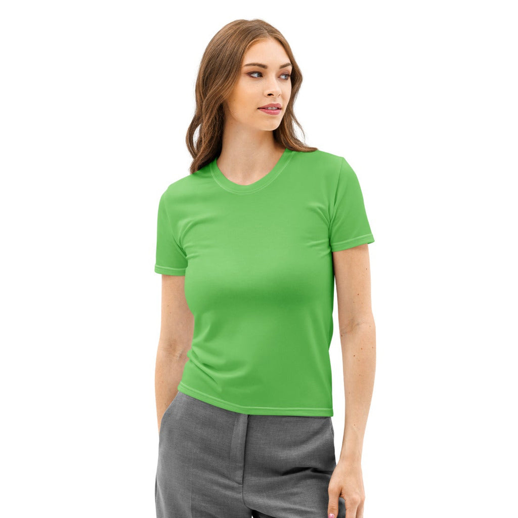 Woman wearing a green t-shirt and gray pants on a white background