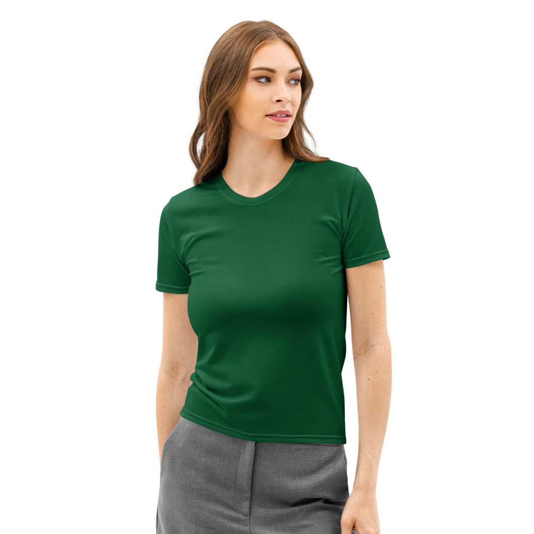 Woman wearing a green t-shirt and gray pants on a white background