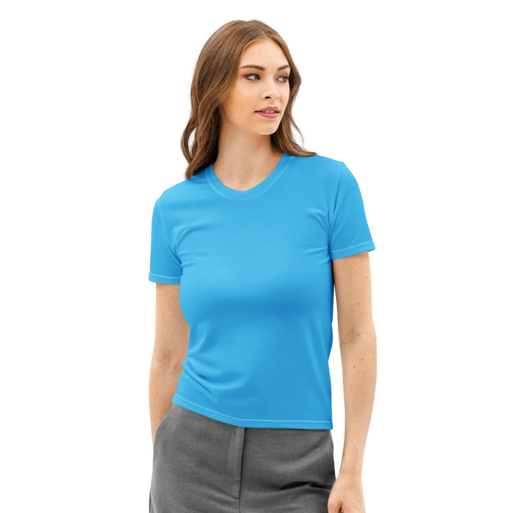 Woman wearing a blue t-shirt and gray pants on a white background