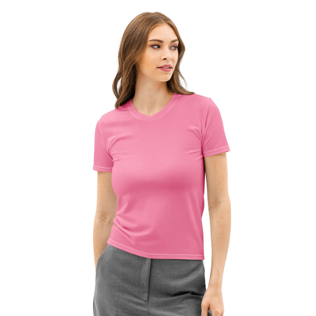 Woman wearing a pink t-shirt and gray pants on a white background