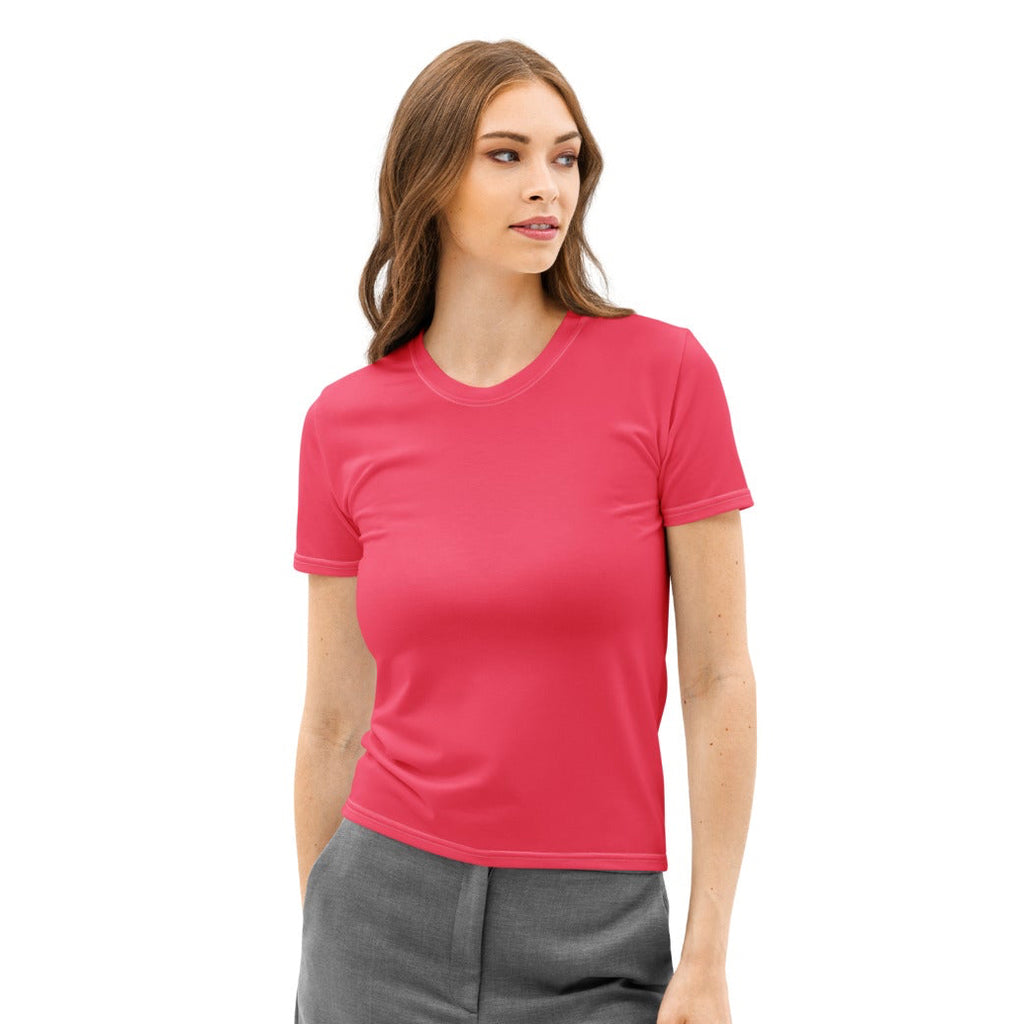 Woman wearing a pink shirt and gray pants on a white background