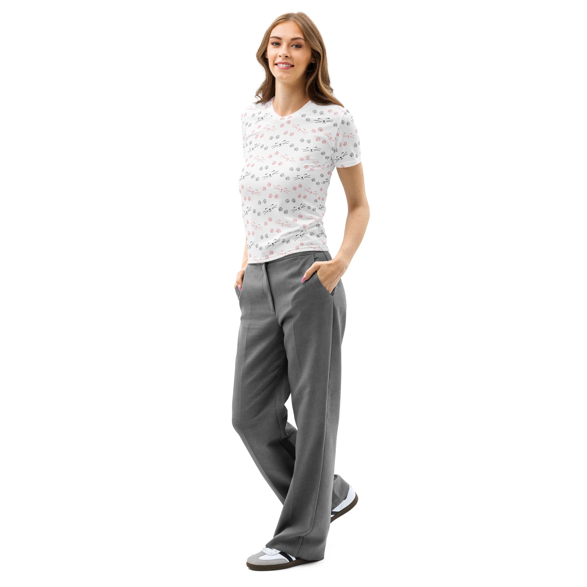 A woman wearing a white women’s cat paw and whiskers cotton t-shirt with a subtle floral pattern and gray trousers