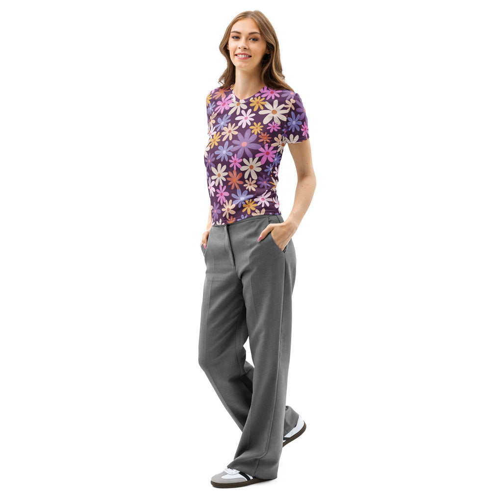 A woman wearing a women’s purple floral cotton t-shirt with soft stretch and pilling resistant fabric paired with gray trousers
