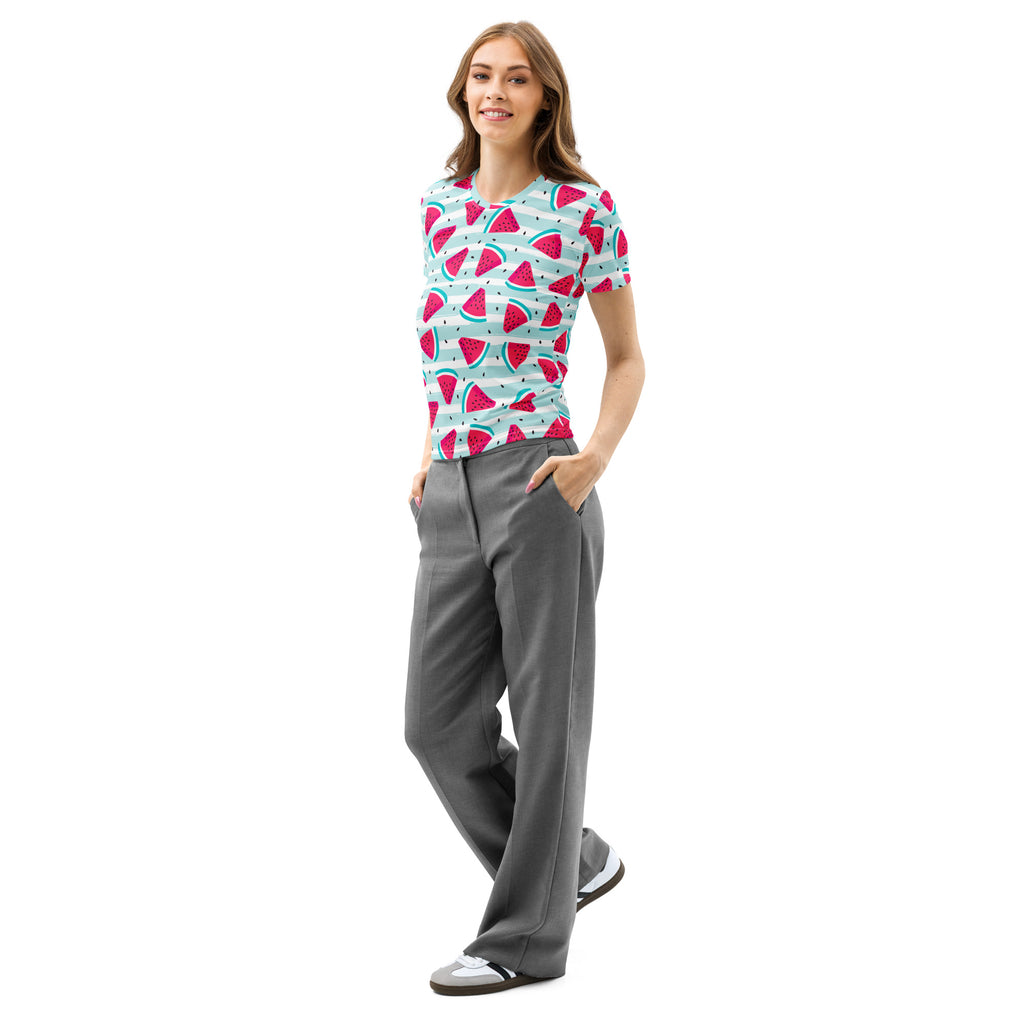 A woman wearing a women’s soft stretch cotton t-shirt with a playful watermelon slice pattern on light blue background