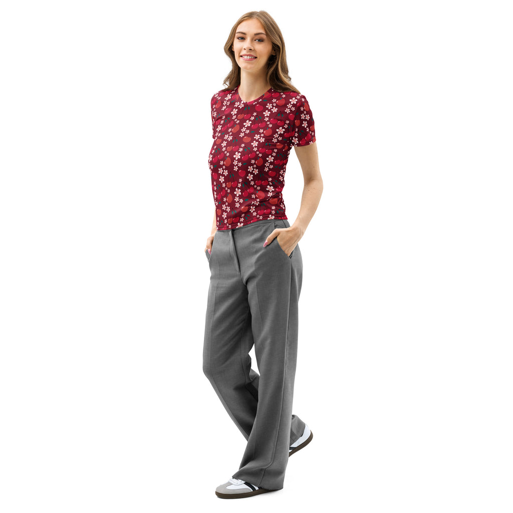 A woman wears a soft stretch pilling resistant women’s cherry blossom fruit cotton t-shirt in red floral print