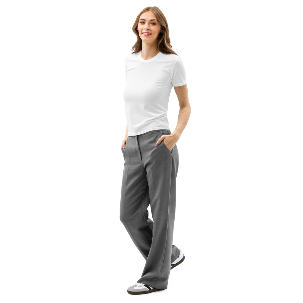 A woman wears a women’s white cotton t-shirt with soft stretch and pilling resistant fabric paired with gray trousers