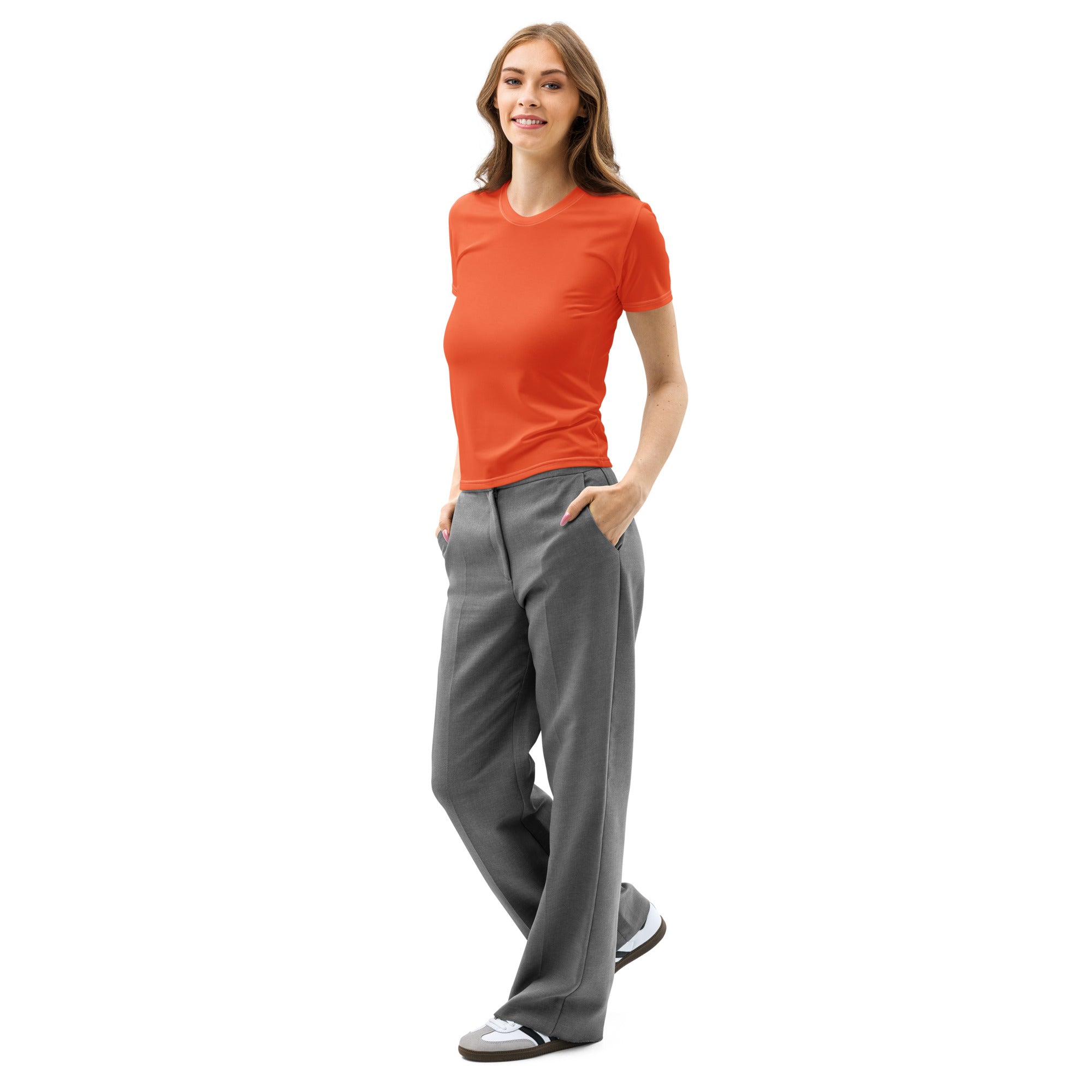 A woman wearing a women’s orange cotton t-shirt with soft stretch and pilling resistant fabric paired with gray trousers