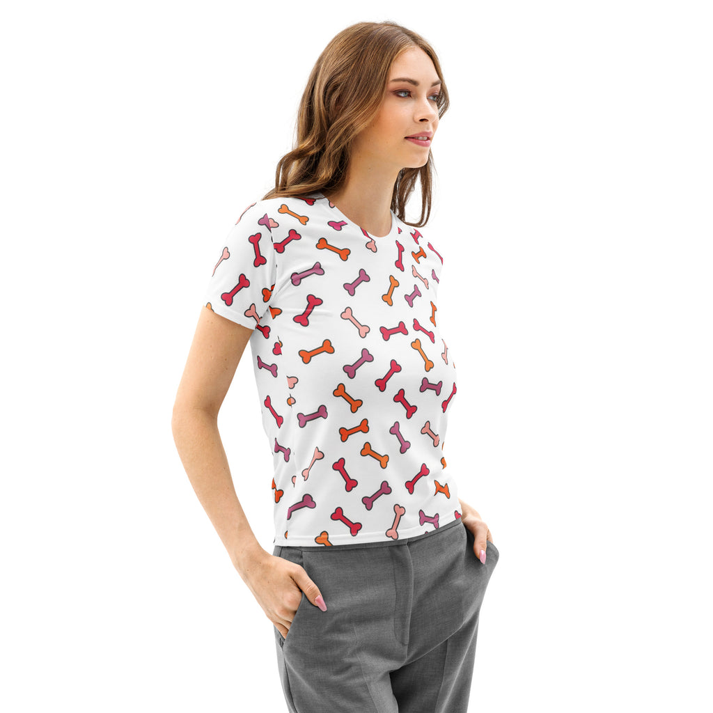 Women’s white cotton short-sleeved t-shirt with playful multicolored dog bone print in pink orange and red