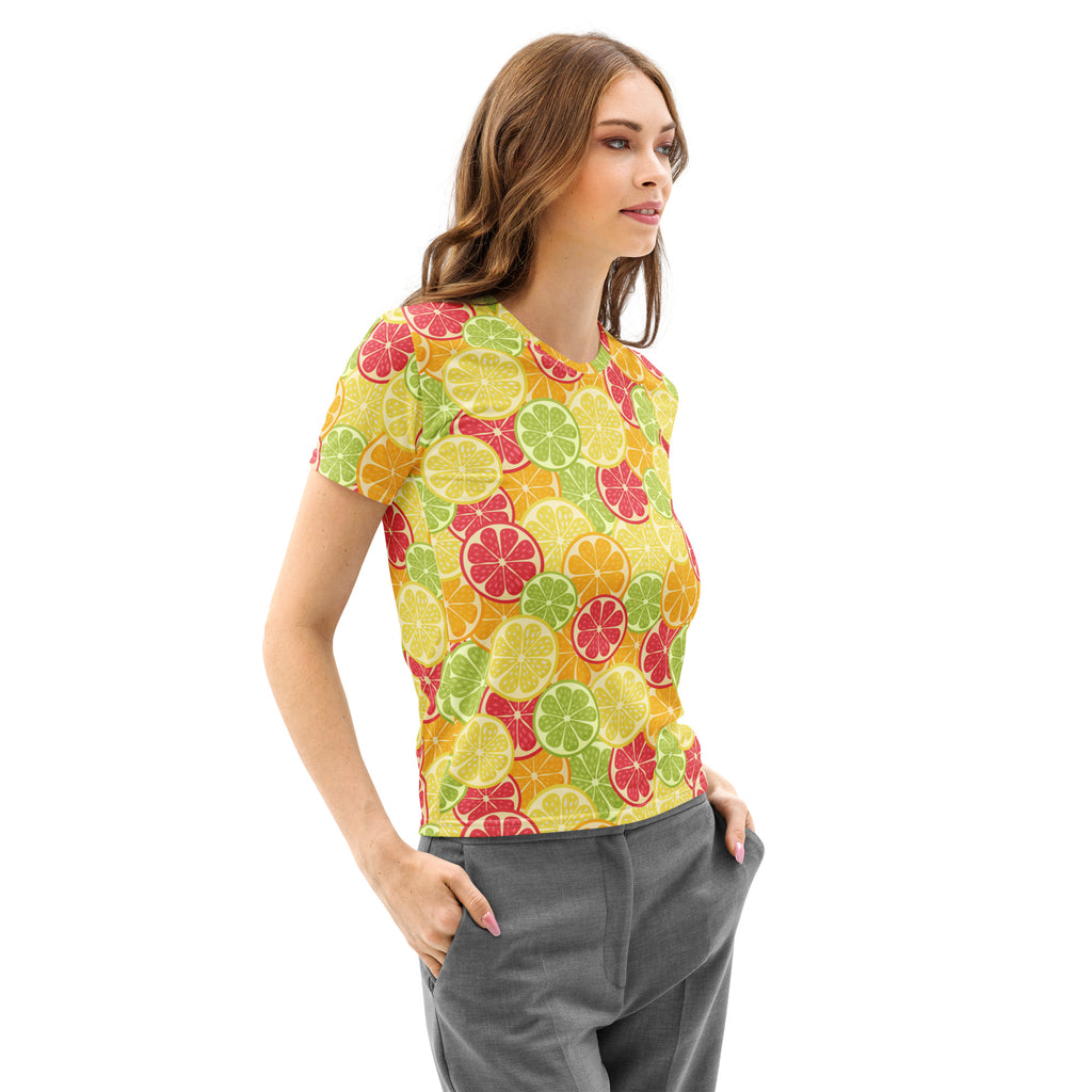 A vibrant yellow women’s cotton t-shirt with playful sliced citrus fruit pattern in green orange and pink hues