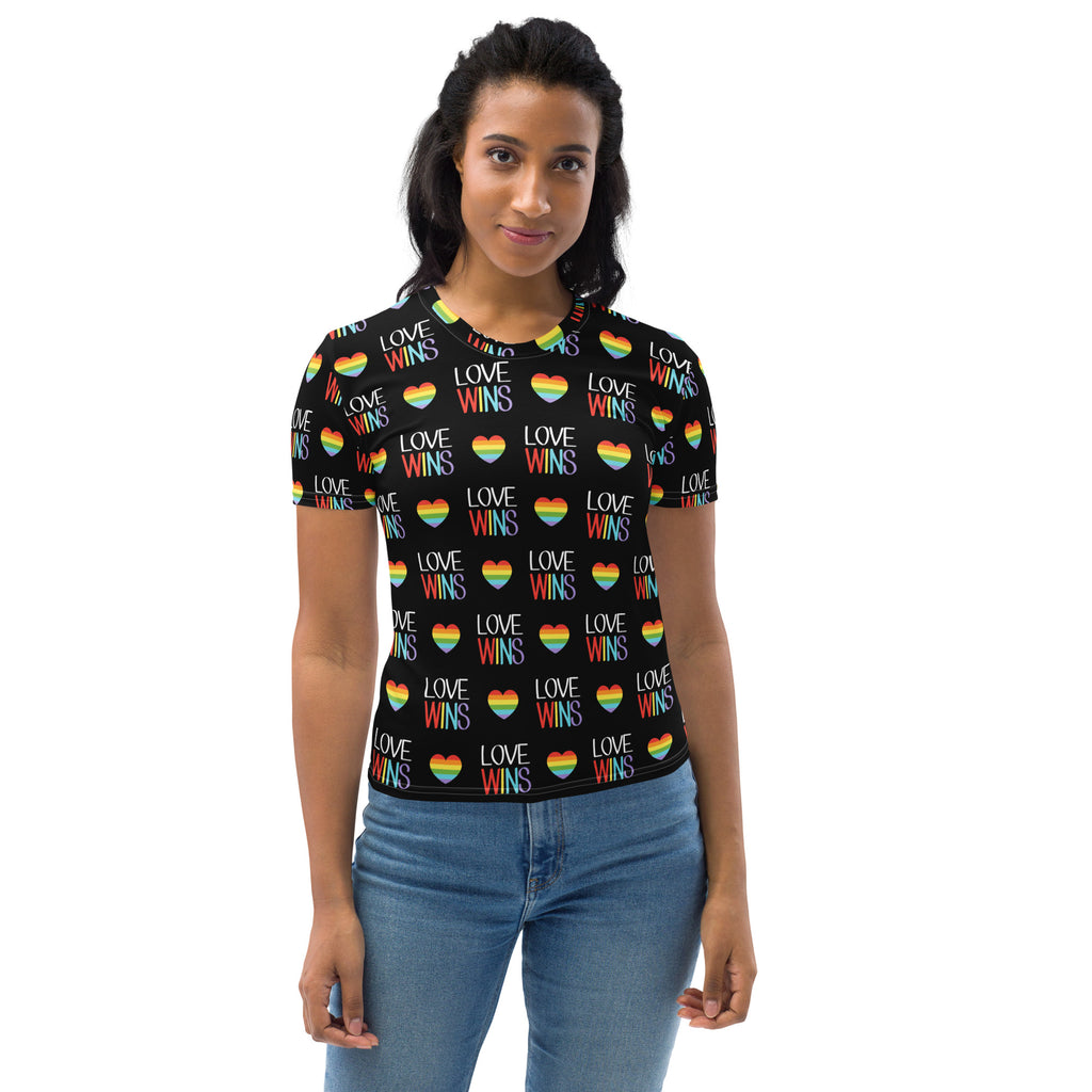 Black women’s soft stretch jersey t-shirt with rainbow heart pattern and white love wins text for pride wear