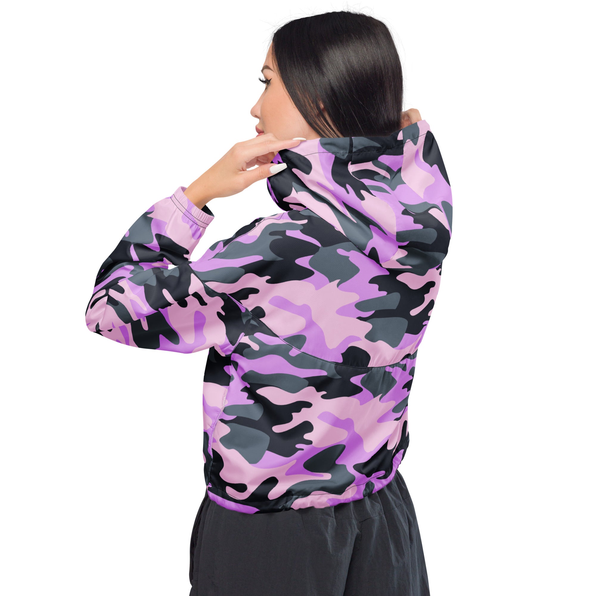 A vibrant pink and black camouflage patterned women’s cropped windbreaker with adjustable hood and pockets