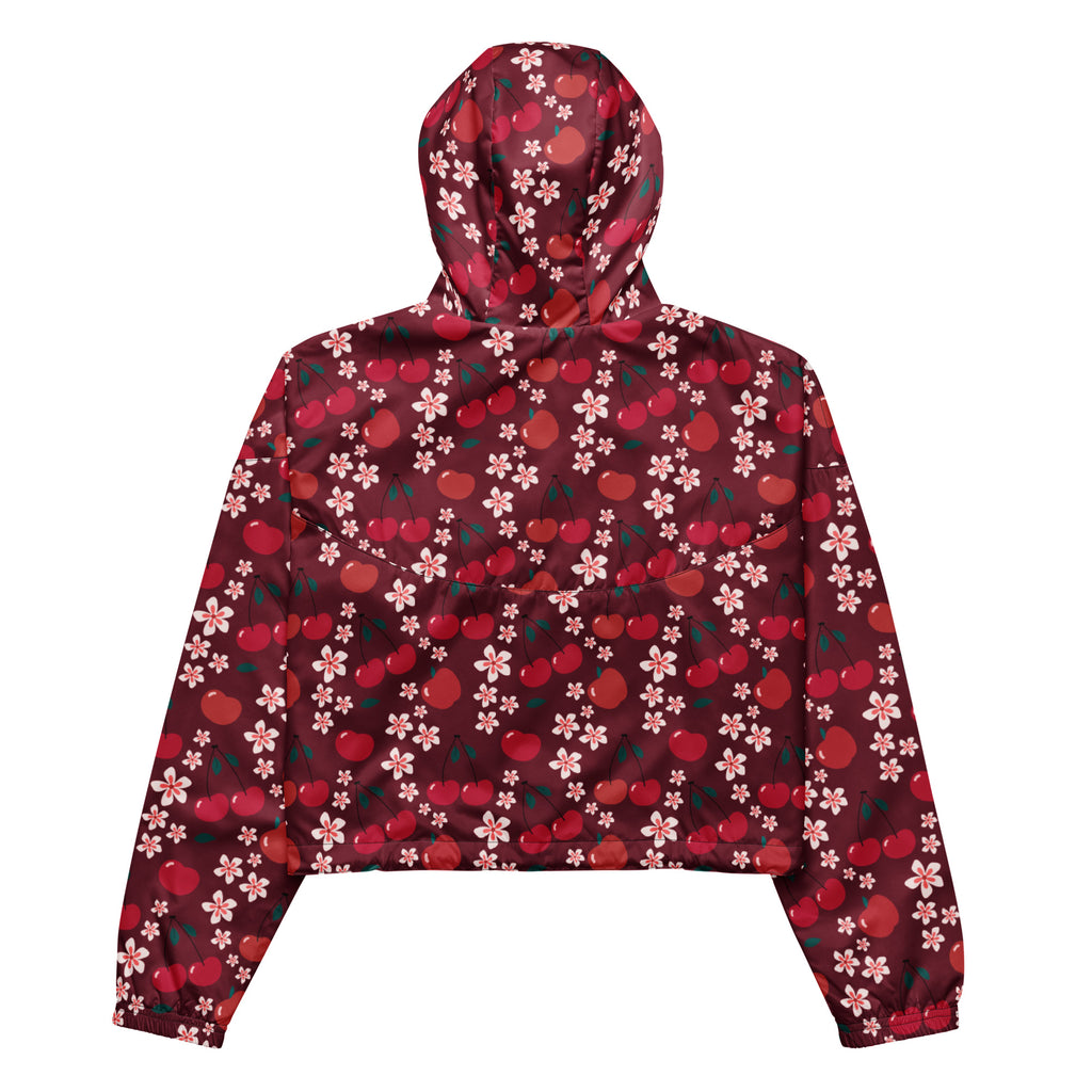 A maroon women’s cherry blossom cropped windbreaker with red cherry and pink blossom pattern and adjustable hood