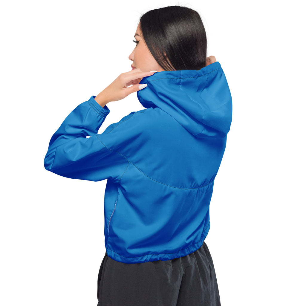 Women’s blue cropped windbreaker jacket with lightweight water resistant fabric, adjustable hood, and elasticated cuffs