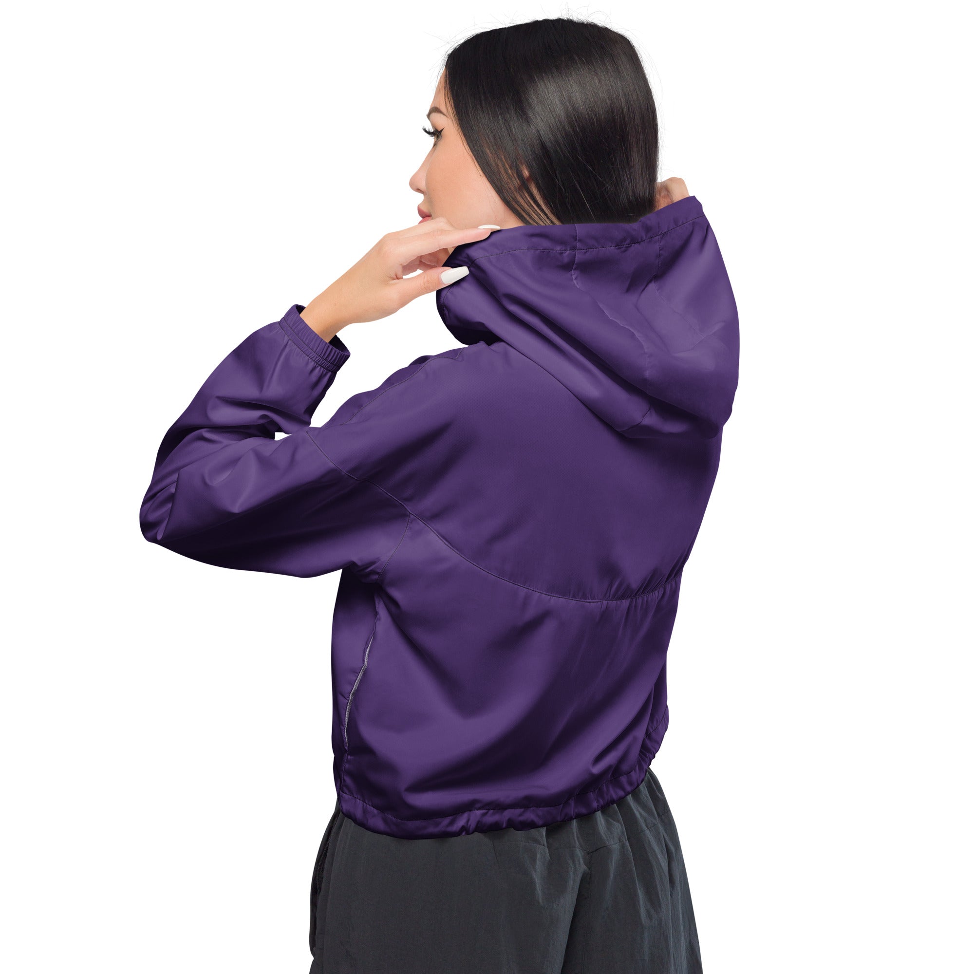 Women’s dark purple cropped windbreaker with lightweight smooth fabric, elastic cuffs, adjustable hood, and pockets