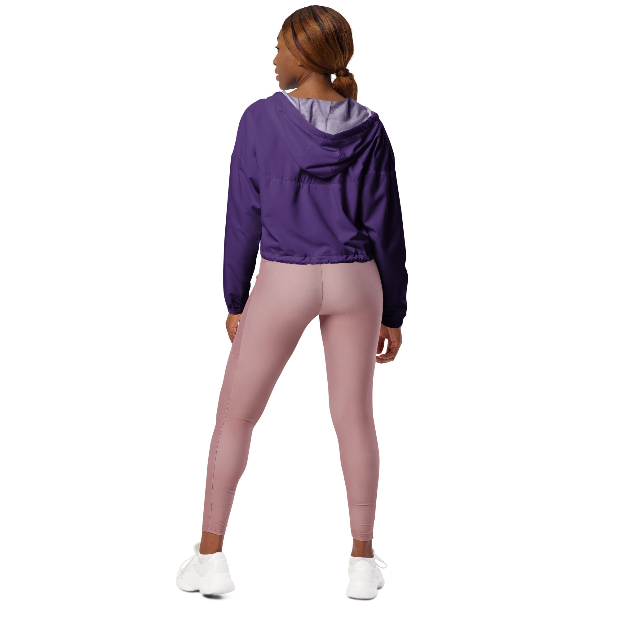 Women’s dark purple cropped windbreaker with adjustable hood and pockets featuring a lavender inner lining