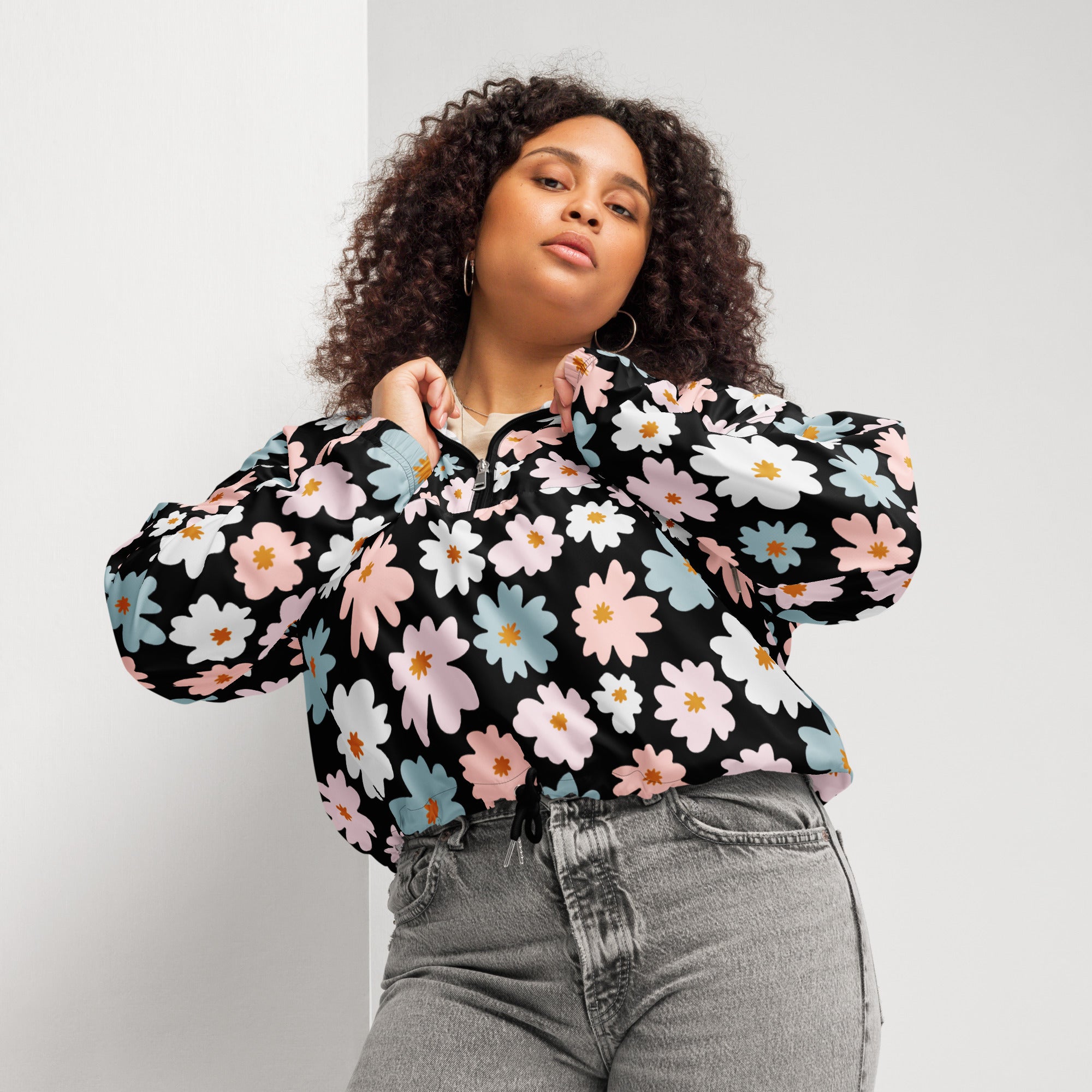 Women’s retro floral cropped windbreaker in black with pink white and blue daisy patterns lightweight and water resistant