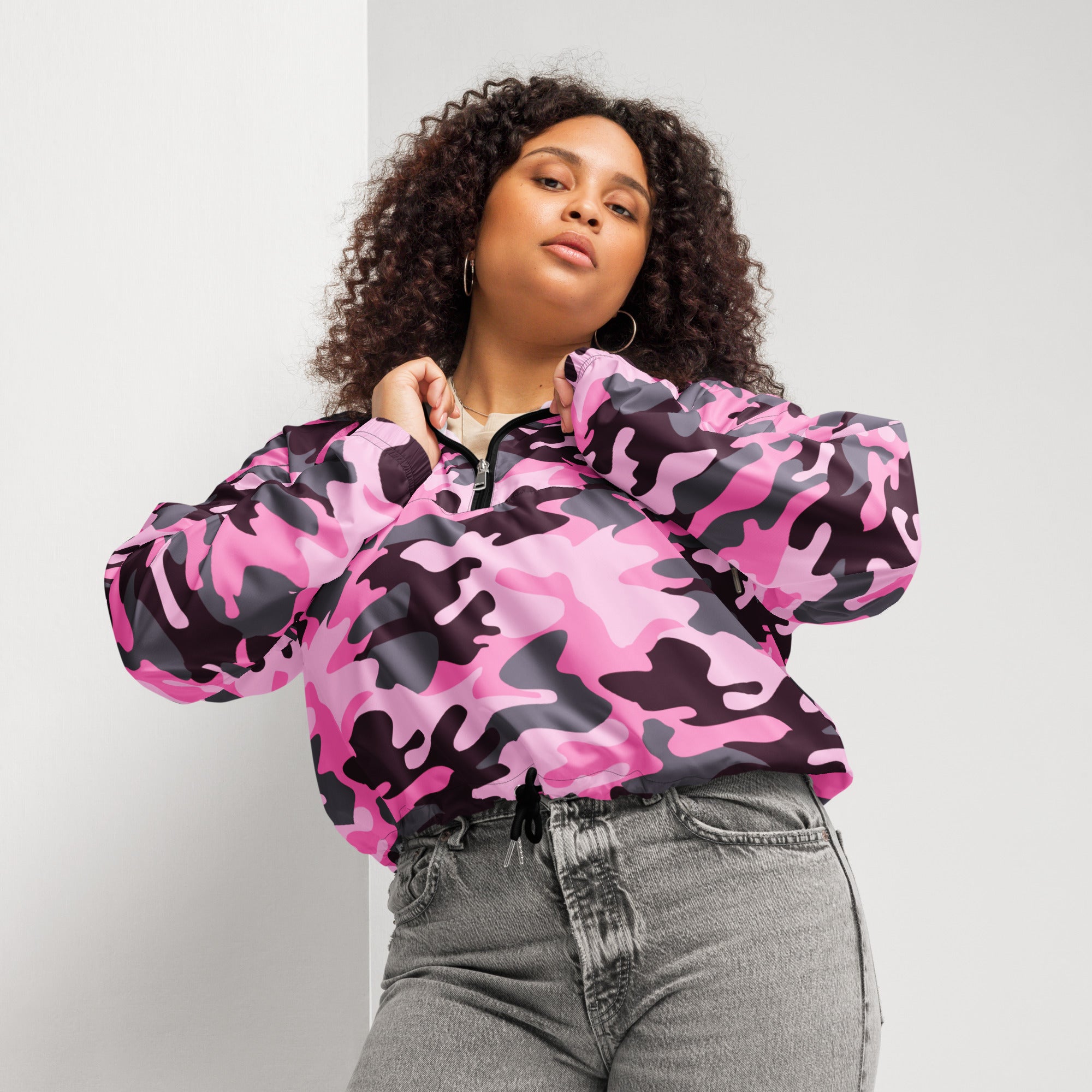 Women’s pink and black camouflage cropped bomber jacket with lightweight water resistant fabric and adjustable hood