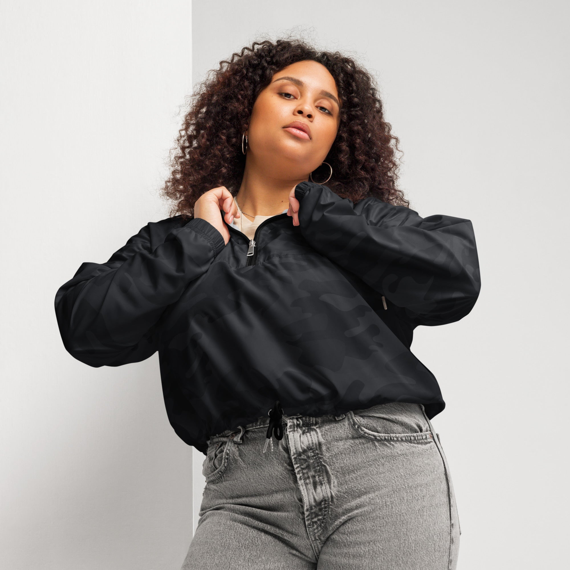 Women’s black nylon bomber jacket with half-zip front and drawstring waist lightweight and water resistant
