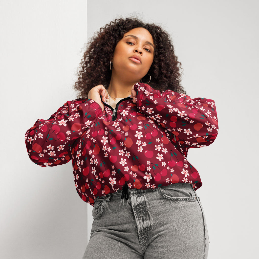 Women’s vibrant red cherry blossom cropped bomber jacket with puffy sleeves and black zipper closure