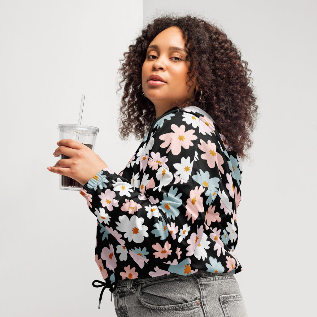 Black long-sleeved blouse with vibrant pastel pink white and blue floral pattern lightweight water resistant jacket