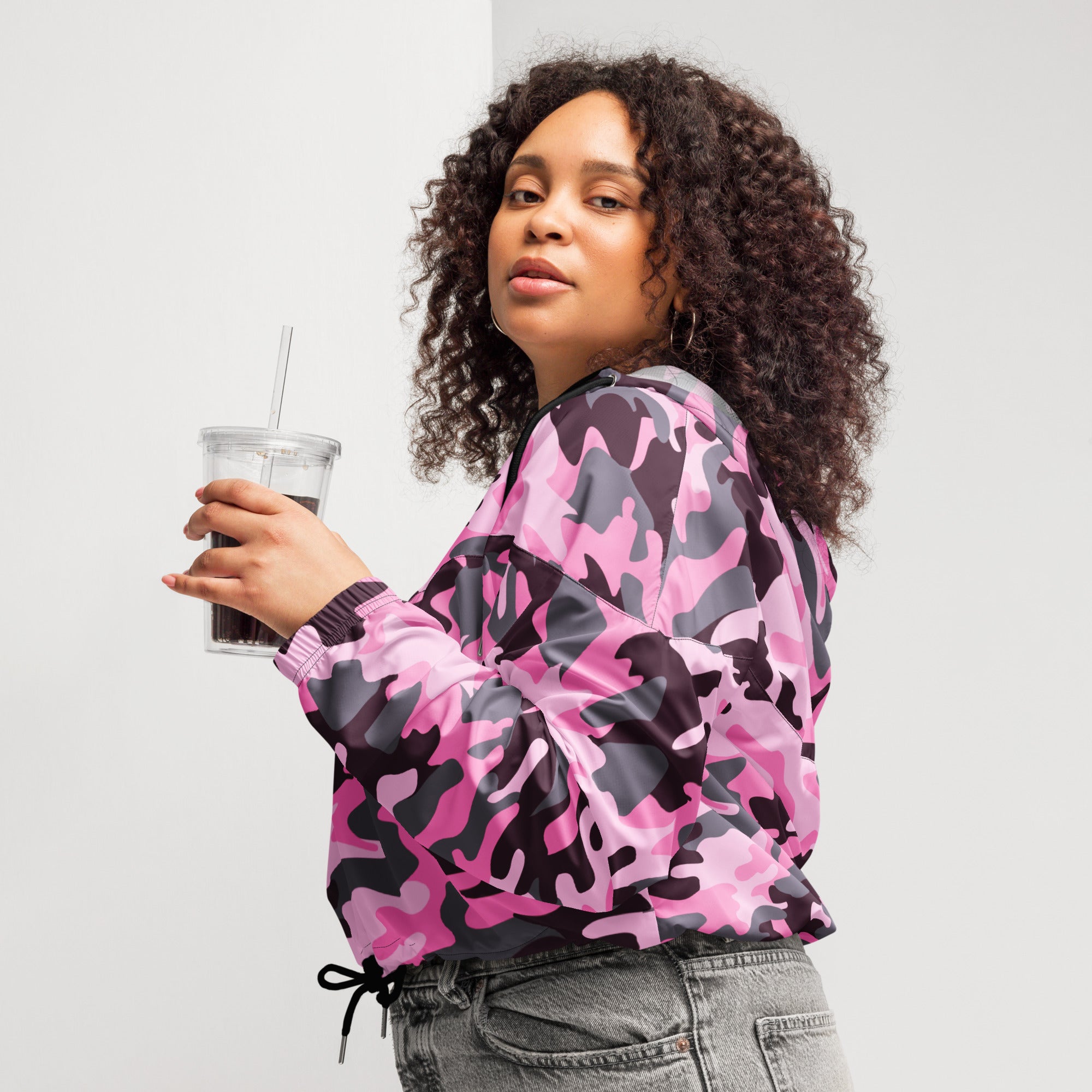 Women’s pink and black camouflage cropped windbreaker jacket with ribbed cuffs and drawstring waist front view