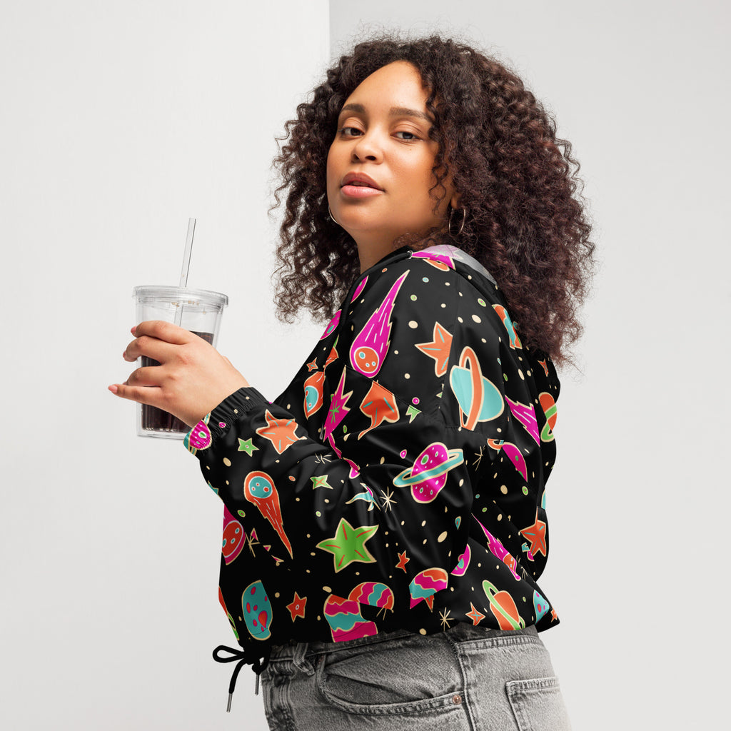 Black women’s retro space cropped windbreaker with vibrant pink teal orange and green space graphics lightweight and water resistant