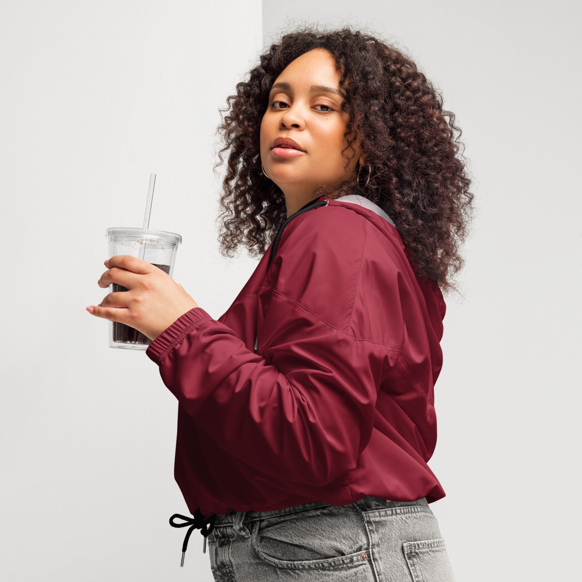 Women’s burgundy nylon bomber jacket with black drawstring waistband lightweight and water resistant windbreaker