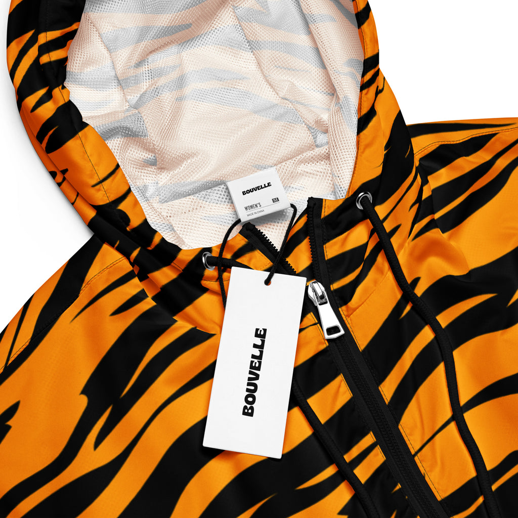 Women’s bouvvelle tiger stripe cropped windbreaker jacket in orange and black with mesh-lined adjustable hood and pockets